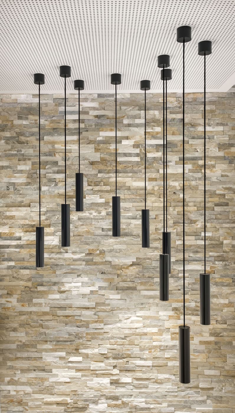A slim LED pendant casting a soft, even pool of light