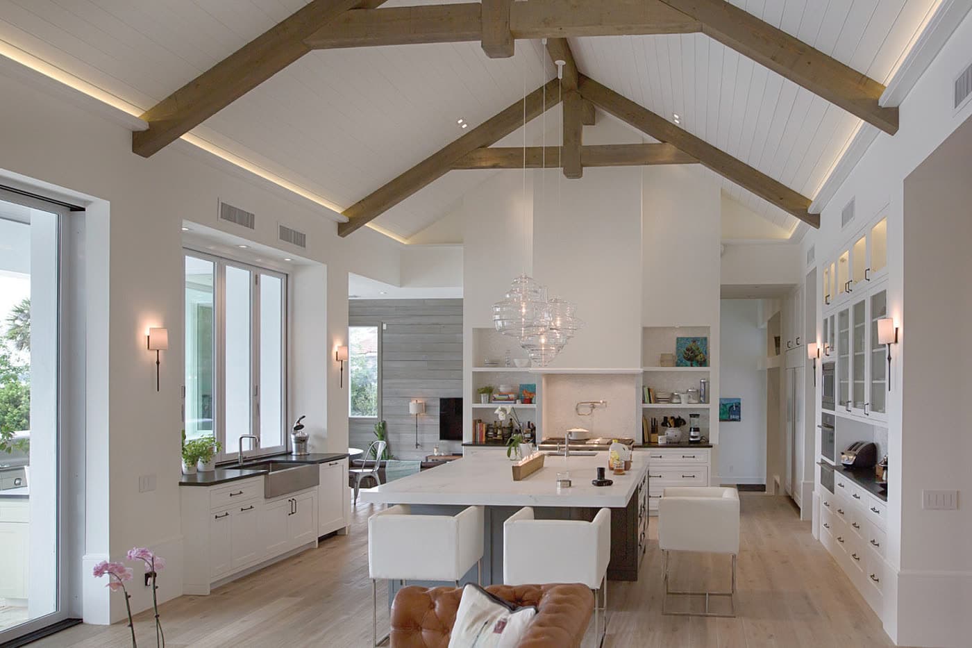 A luxury kitchen with dimmed, layered task and ambient lighting